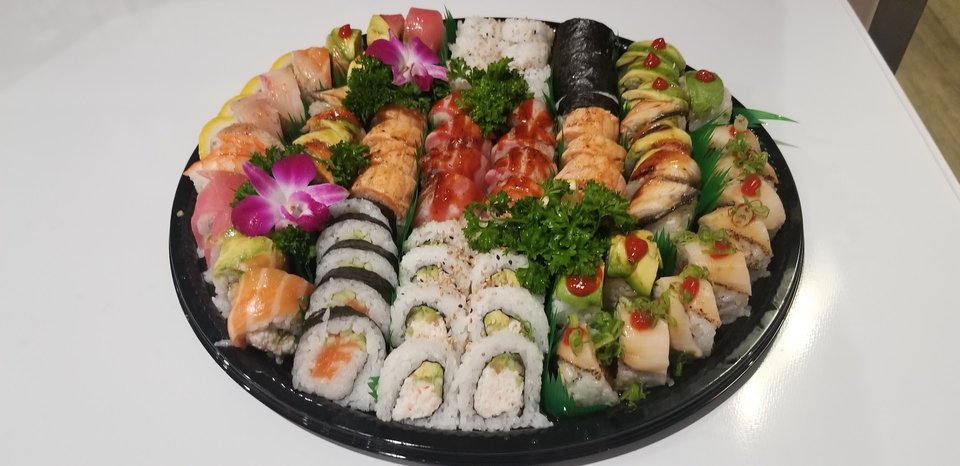 Assorted Japanese dishes on white plates.